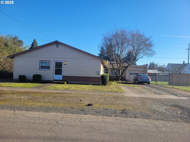 exterior space with a garage and a front yard