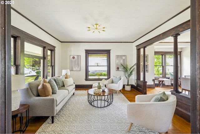 4919 NE 18th Ave, Portland, OR 97211 - living room with ornate columns, wood finished floors, and crown molding