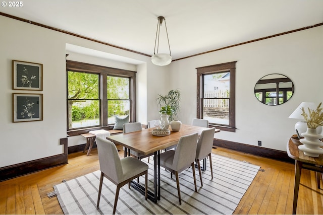 4919 NE 18th Ave, Portland, OR 97211 - dining space featuring healthy amount of natural light, light wood-type flooring, and crown molding
