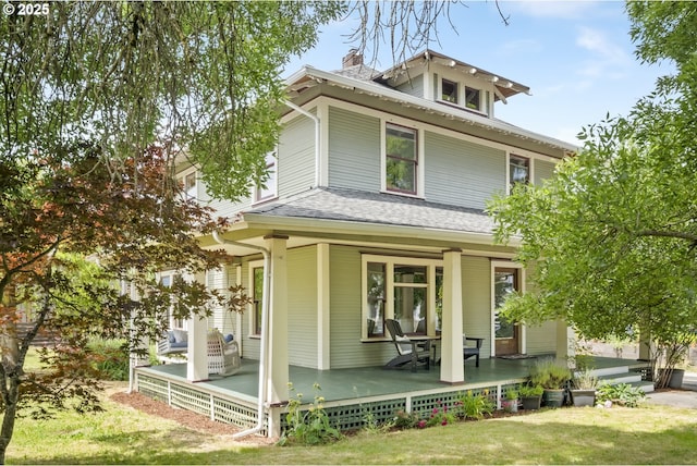 4919 NE 18th Ave, Portland, OR 97211 - view of front of house with covered porch, a chimney, roof with shingles, and a front yard