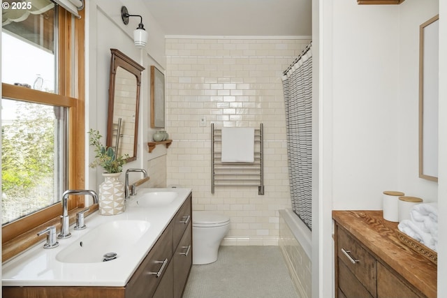 4919 NE 18th Ave, Portland, OR 97211 - full bathroom with double vanity, plenty of natural light, tile patterned floors, and shower / bath combination with curtain