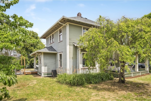4919 NE 18th Ave, Portland, OR 97211 - back of house with a deck, a chimney, a yard, and a shingled roof