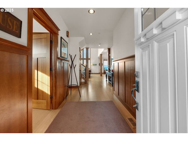 foyer featuring recessed lighting, stairway, and light wood finished floors
