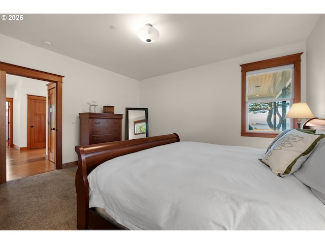 carpeted bedroom with baseboards