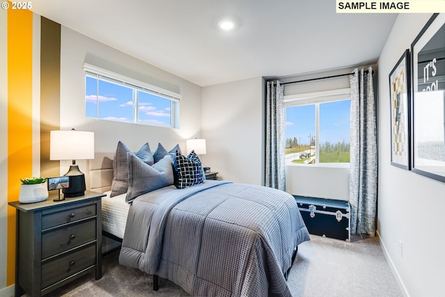 carpeted bedroom featuring multiple windows, recessed lighting, and baseboards