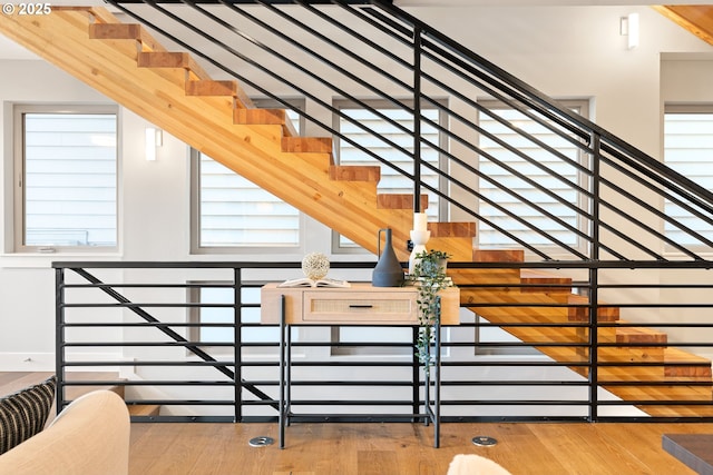 staircase with wood finished floors