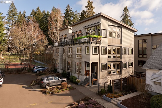 view of front of house with fence