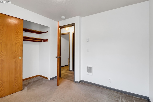 70 Jefferson Aly, Eugene, OR 97402 - unfurnished bedroom featuring baseboards, carpet floors, and a closet
