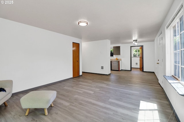70 Jefferson Aly, Eugene, OR 97402 - unfurnished living room with wood finished floors and baseboards
