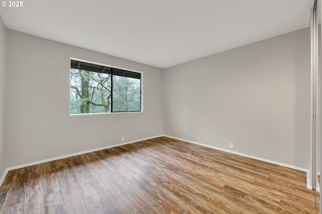 unfurnished room featuring light wood-type flooring