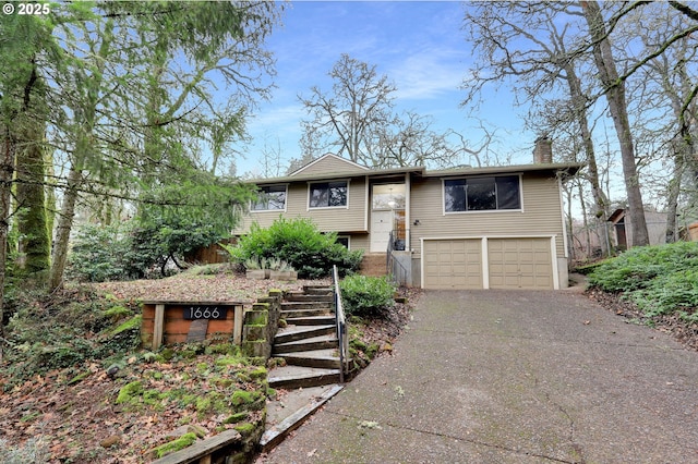 bi-level home featuring a garage