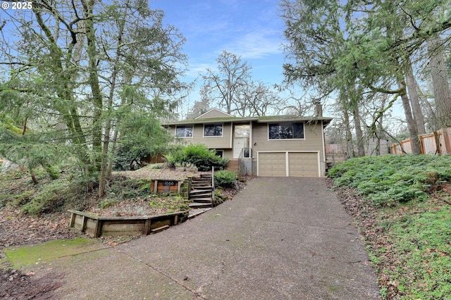 bi-level home featuring a garage