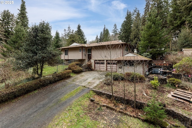 view of front of property featuring an attached garage and concrete driveway