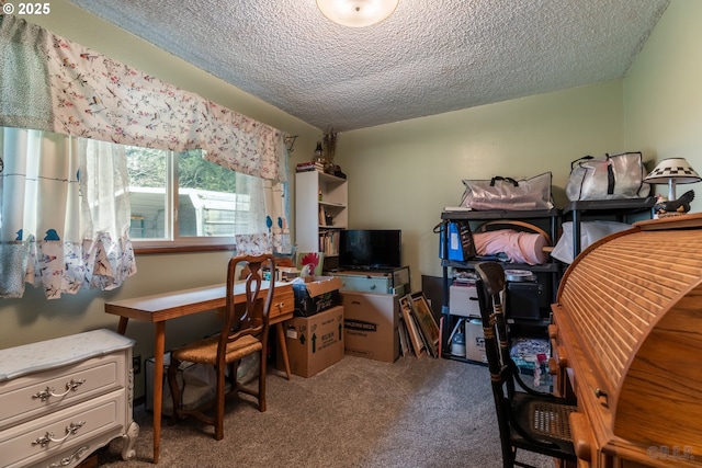 carpeted home office with a textured ceiling