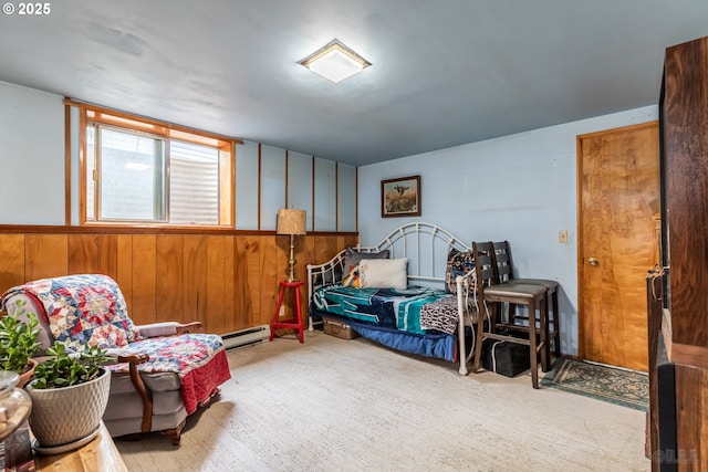 sitting room featuring a baseboard radiator, wainscoting, light carpet, and wood walls