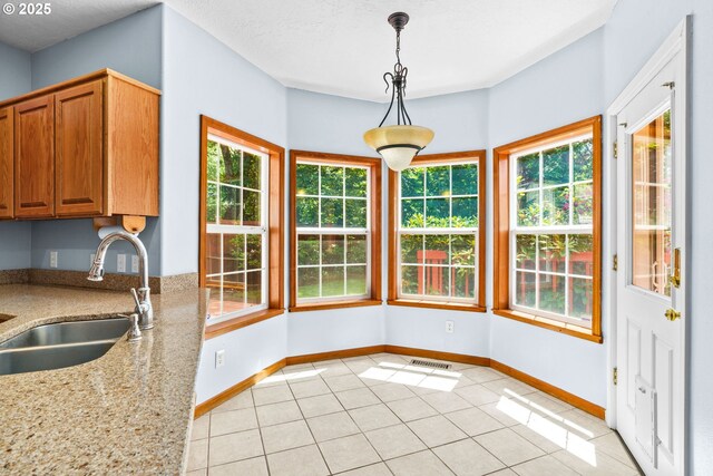 4060 Hampshire Ln, Eugene, OR 97404 - unfurnished dining area featuring a sink and light tile patterned floors