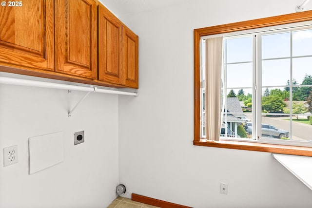 4060 Hampshire Ln, Eugene, OR 97404 - laundry room with electric dryer hookup, healthy amount of natural light, and cabinet space