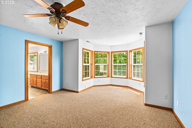 4060 Hampshire Ln, Eugene, OR 97404 - spare room featuring light carpet, a textured ceiling, and a ceiling fan