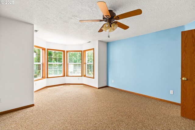 4060 Hampshire Ln, Eugene, OR 97404 - empty room featuring carpet floors, a ceiling fan, and a textured ceiling