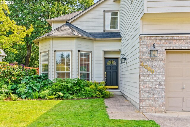 4060 Hampshire Ln, Eugene, OR 97404 - view of front of house with a shingled roof and a front yard