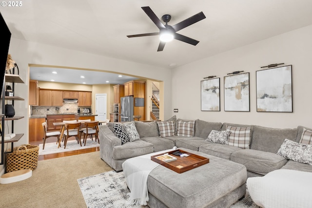 15655 SW Greenfield Dr, Portland, OR 97224 - living area featuring a ceiling fan, recessed lighting, light colored carpet, and arched walkways