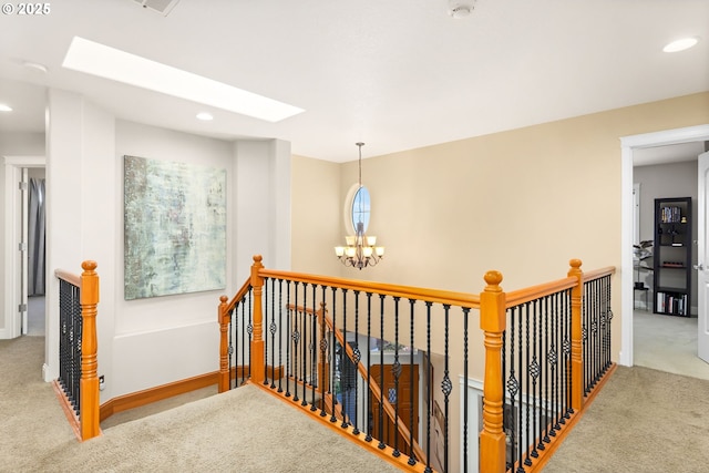 15655 SW Greenfield Dr, Portland, OR 97224 - hallway with an upstairs landing, carpet, a skylight, recessed lighting, and a chandelier