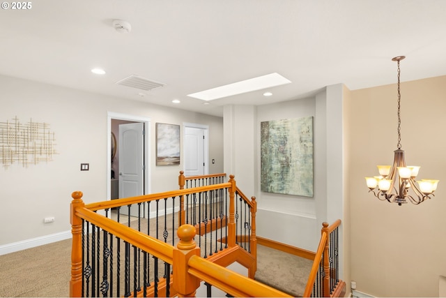 15655 SW Greenfield Dr, Portland, OR 97224 - corridor with an upstairs landing, carpet floors, a chandelier, recessed lighting, and a skylight