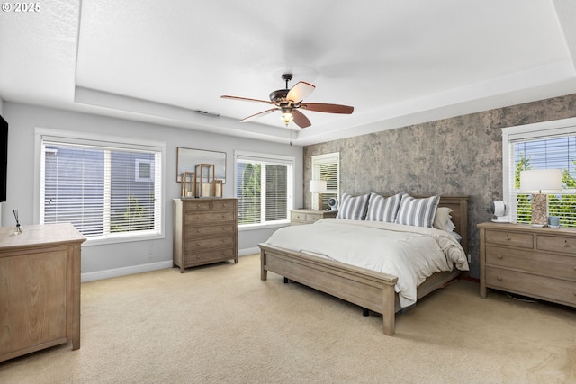 15655 SW Greenfield Dr, Portland, OR 97224 - bedroom featuring light carpet, multiple windows, and a ceiling fan