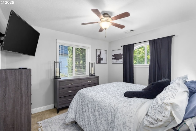 15655 SW Greenfield Dr, Portland, OR 97224 - bedroom with baseboards and a ceiling fan