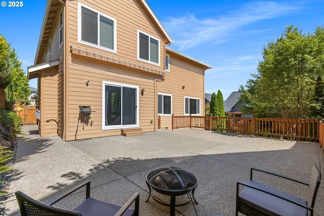 15655 SW Greenfield Dr, Portland, OR 97224 - rear view of property featuring an outdoor fire pit and a patio area