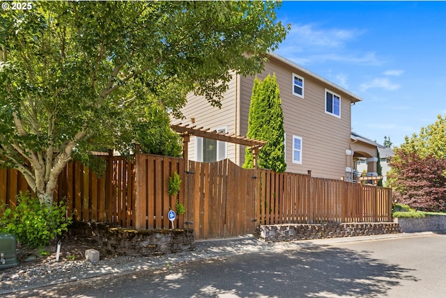 15655 SW Greenfield Dr, Portland, OR 97224 - view of property exterior with a gate
