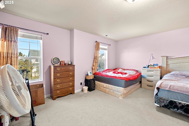 2032 SW 33rd St, Gresham, OR 97080 - carpeted bedroom with multiple windows, baseboards, and a textured ceiling