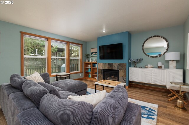 5904 Barefoot Ln, Pacific City, OR 97135 - living area with wood finished floors, a tile fireplace, and recessed lighting