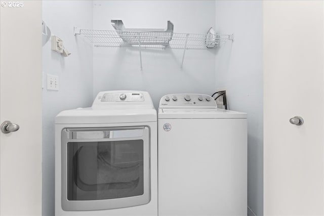 washroom with washer and dryer