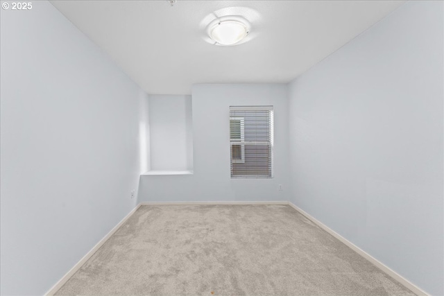 empty room featuring light colored carpet