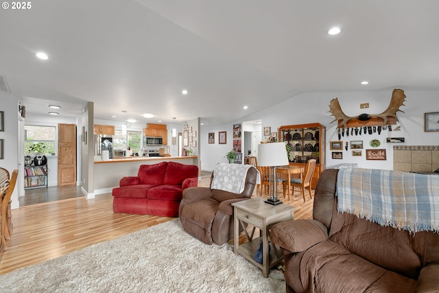 460 Huckleberry Mt Ln, Riddle, OR 97469 - living room featuring light wood finished floors, recessed lighting, vaulted ceiling, and baseboards