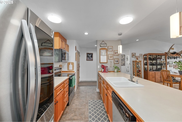 460 Huckleberry Mt Ln, Riddle, OR 97469 - kitchen featuring appliances with stainless steel finishes, a sink, light countertops, decorative light fixtures, and recessed lighting