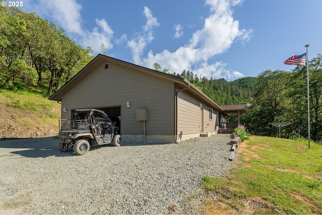 460 Huckleberry Mt Ln, Riddle, OR 97469 - view of property exterior with driveway and a garage