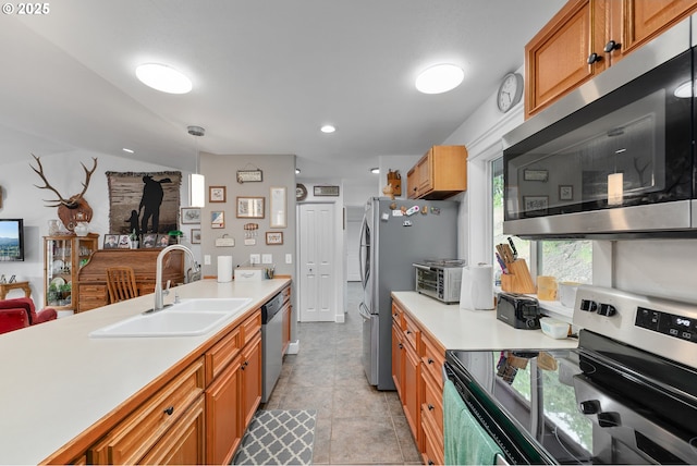 460 Huckleberry Mt Ln, Riddle, OR 97469 - kitchen with appliances with stainless steel finishes, a sink, light countertops, brown cabinets, and recessed lighting