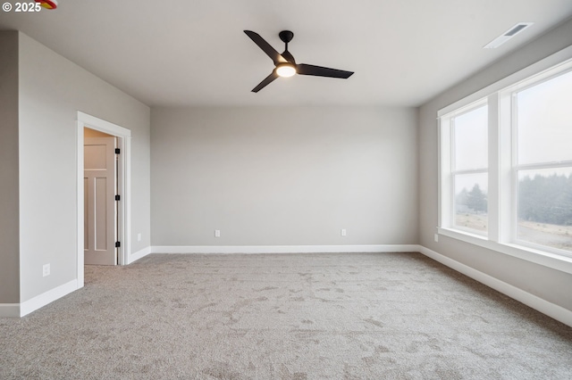 carpeted empty room with ceiling fan