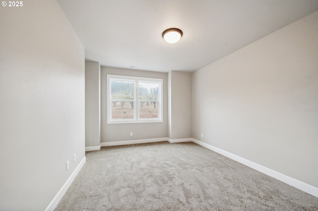 unfurnished room featuring carpet floors