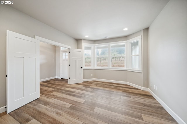 empty room with light wood-type flooring