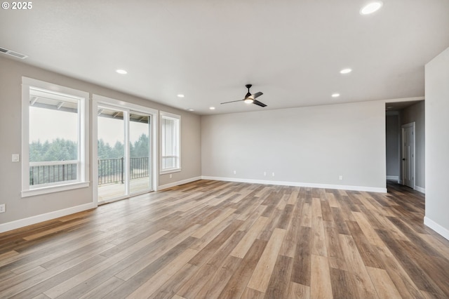 empty room featuring light hardwood / wood-style flooring and ceiling fan