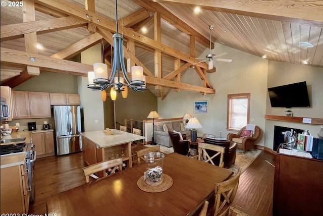 132 E Surfcrest Ave # B2-H, Cannon Beach, OR 97110 - dining room featuring dark wood finished floors, a chandelier, ceiling fan, wooden ceiling with exposed beams, and high vaulted ceiling
