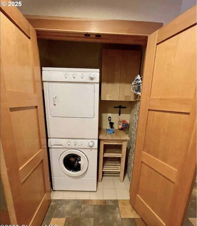 132 E Surfcrest Ave # B2-H, Cannon Beach, OR 97110 - washroom with stacked washer / dryer and light tile patterned flooring
