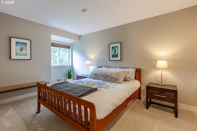 bedroom with visible vents, baseboards, and carpet flooring