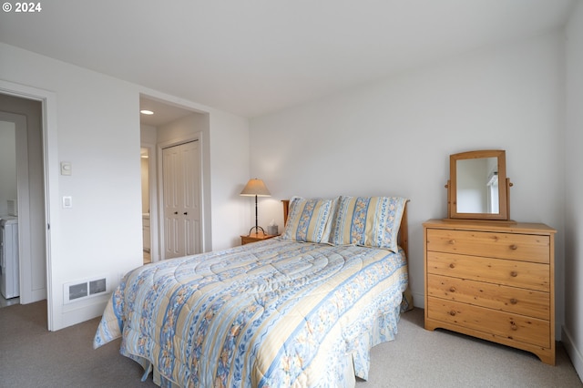 carpeted bedroom with a closet, recessed lighting, and visible vents