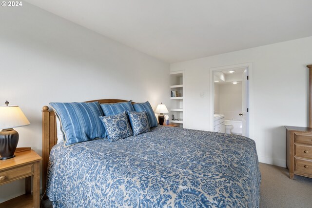 bedroom featuring carpet flooring and ensuite bathroom