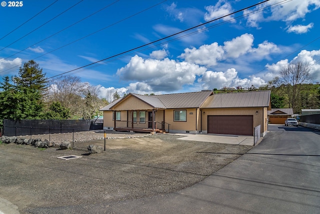 5135 Grange Rd, Roseburg, OR 97471 - view of front of house featuring driveway, a garage, metal roof, crawl space, and covered porch