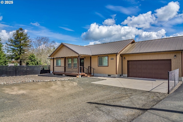 5135 Grange Rd, Roseburg, OR 97471 - view of front of house with an attached garage, a porch, driveway, and metal roof